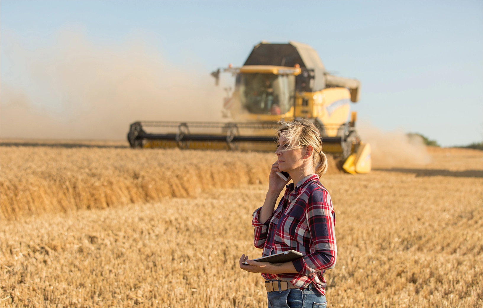 Farmer in a field on their phone